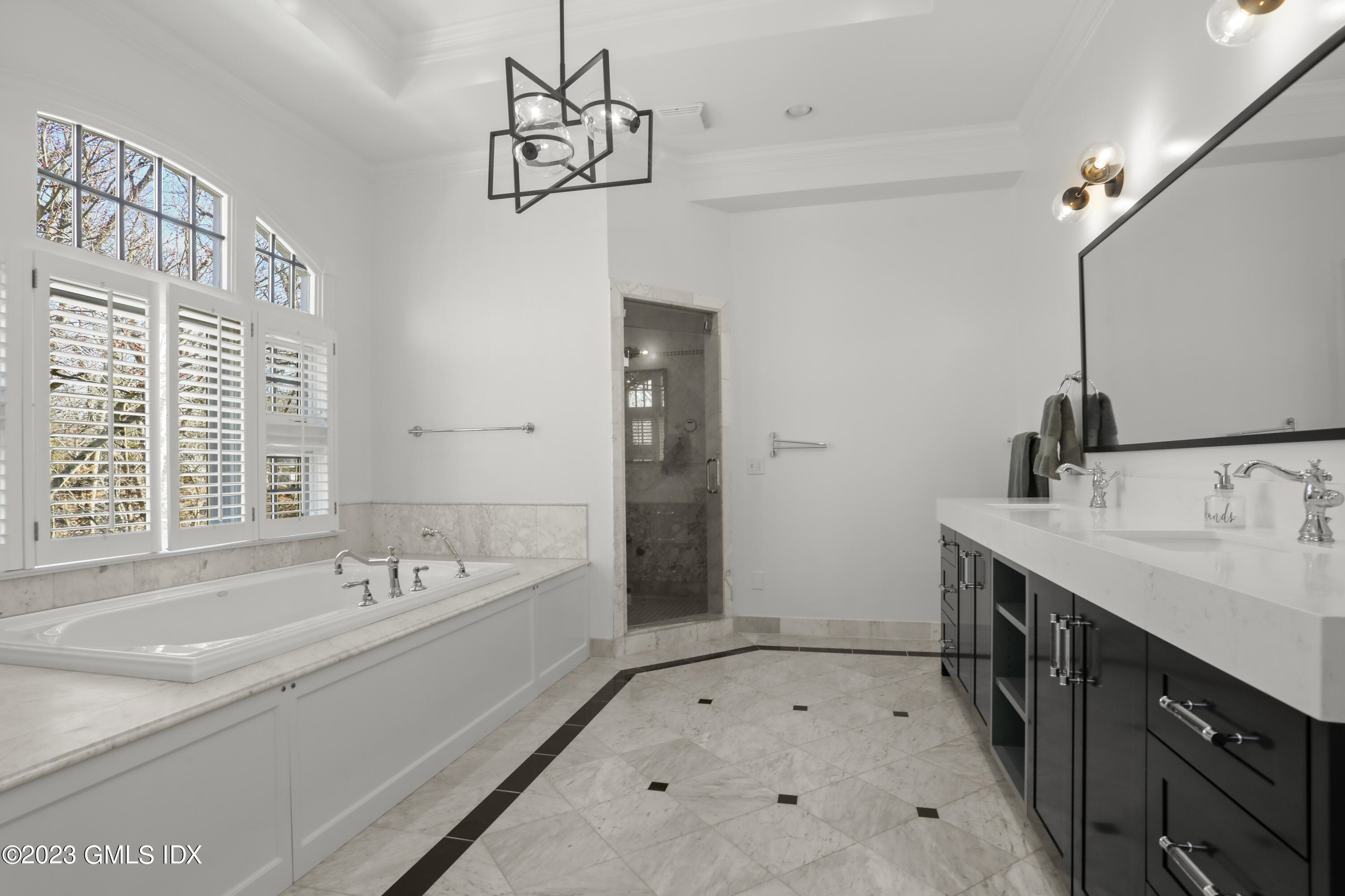 192 Bible Street Cos Cob, CT 06807 - Photo 19 of 32 a spacious bathroom with a tub sink and mirror