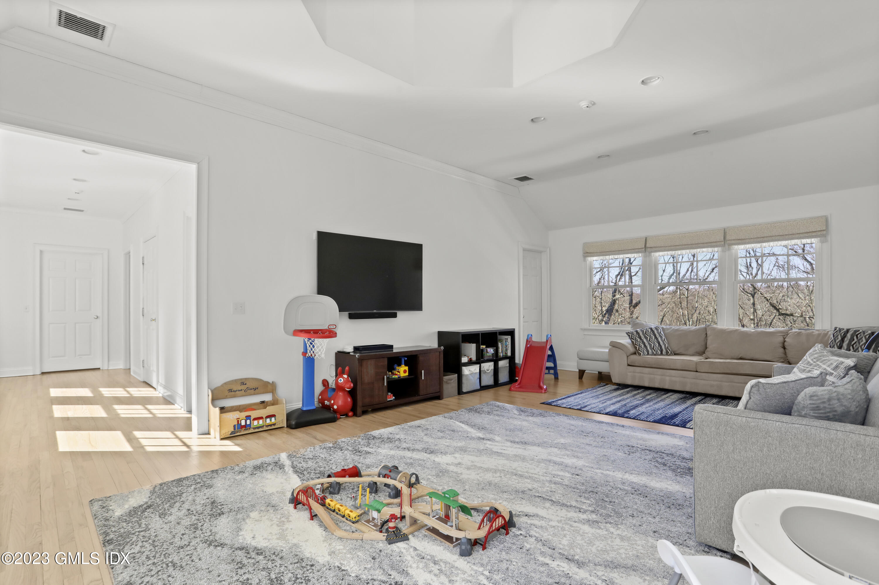 192 Bible Street Cos Cob, CT 06807 - Photo 22 of 32 a living room with furniture and a flat screen tv