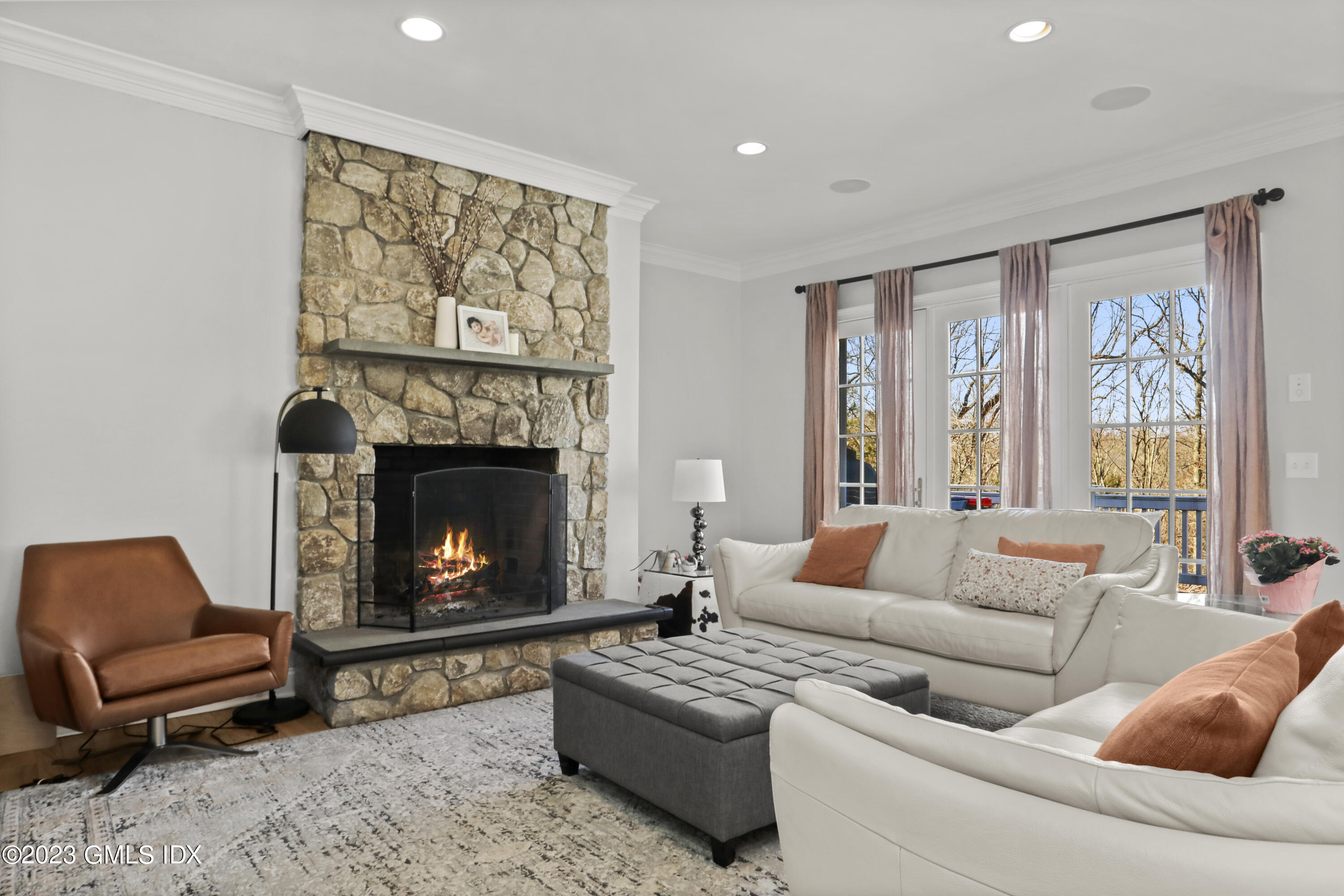 192 Bible Street Cos Cob, CT 06807 - Photo 10 of 32 a living room with furniture and a fireplace
