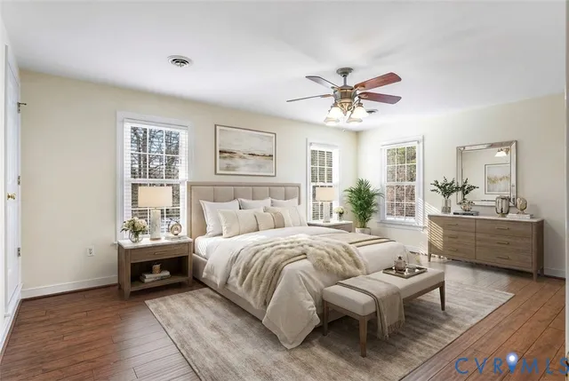 a bedroom with bed and a large window