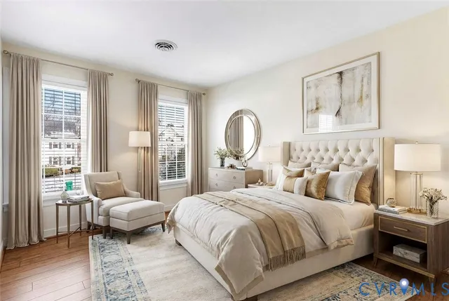 a bedroom with a bed and a couch