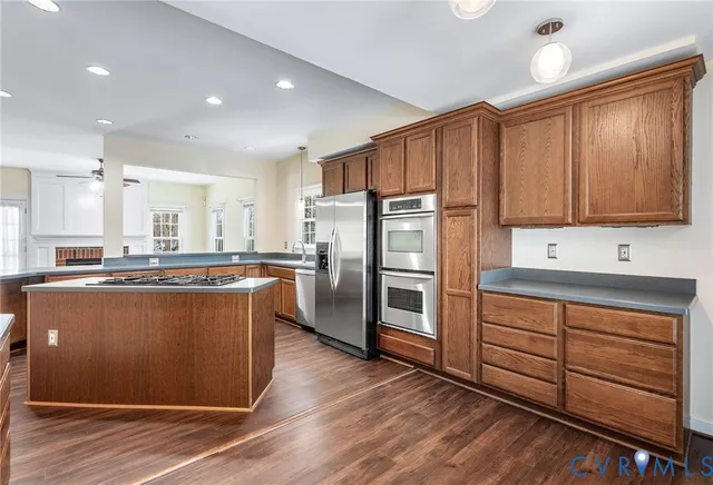 a kitchen with refrigerator and cabinets