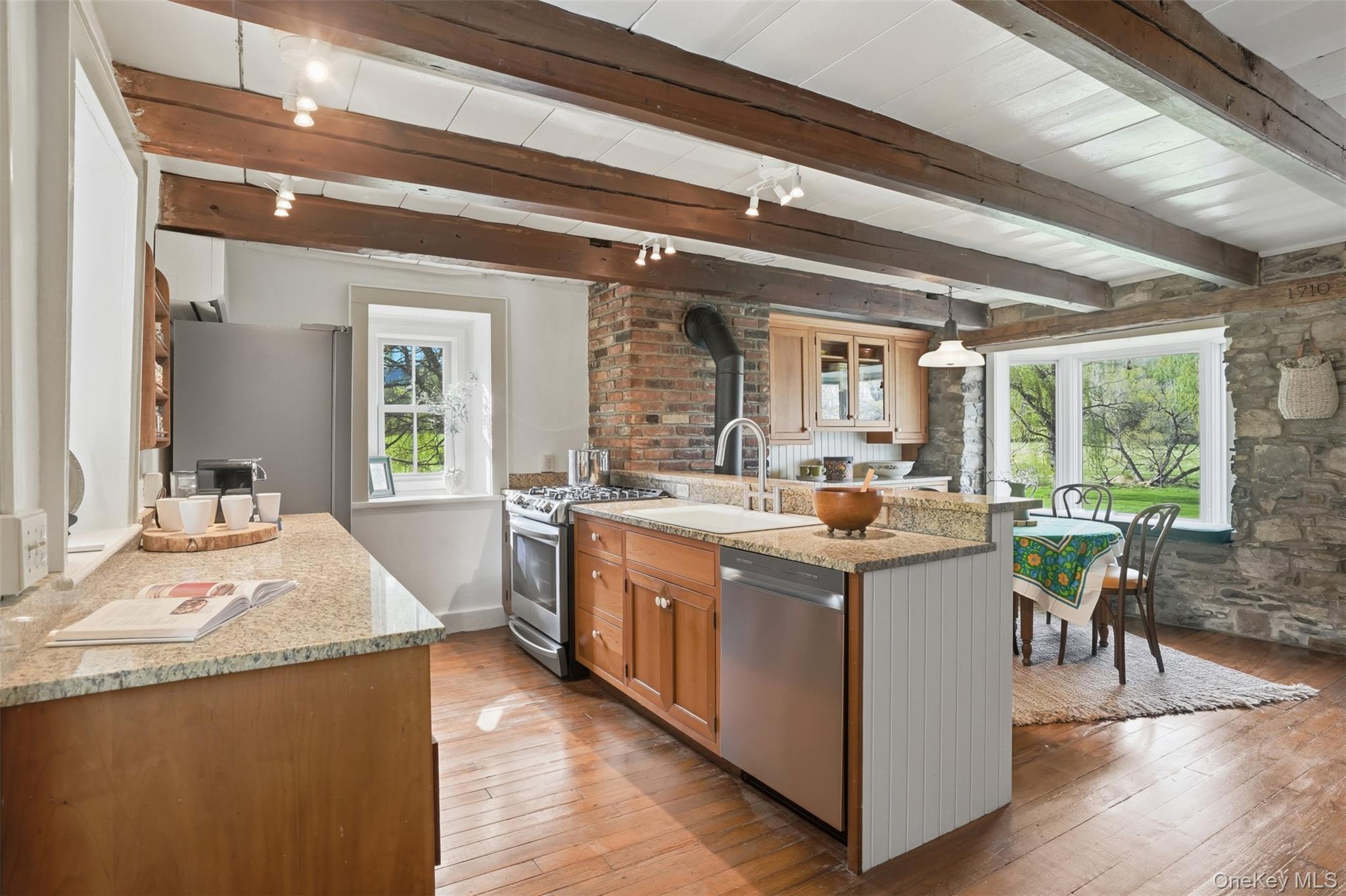 510 Decker Road Wallkill, NY 12589 - Photo 19 of 48 A thoughtfully designed galley kitchen that opens gracefully to the living room, creating a seamless connection between spaces.