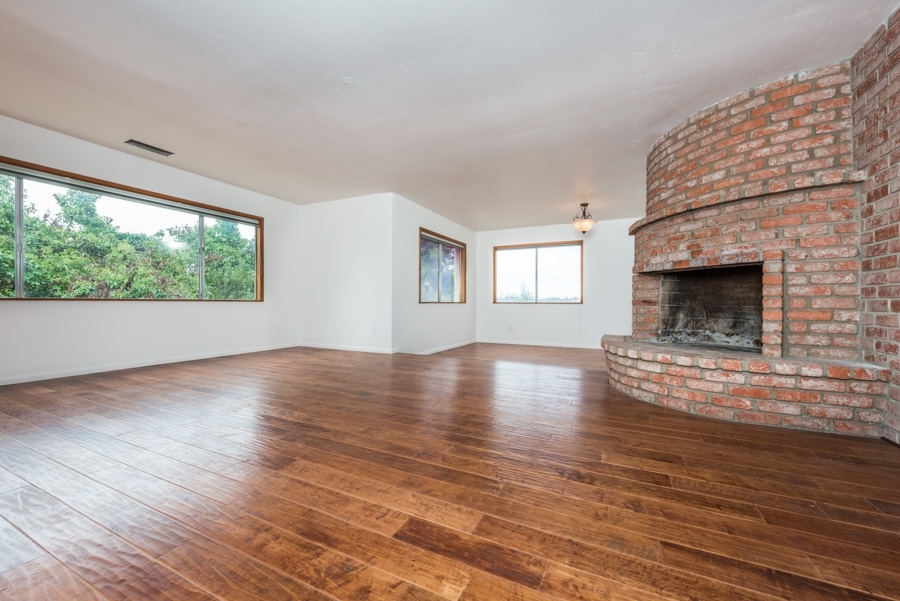28403 Valley Center Road Valley Center, CA 92082 - Photo 5 of 25 Wonderful spacious living room / dining room combo.... beautiful view windows and cozy fireplace!