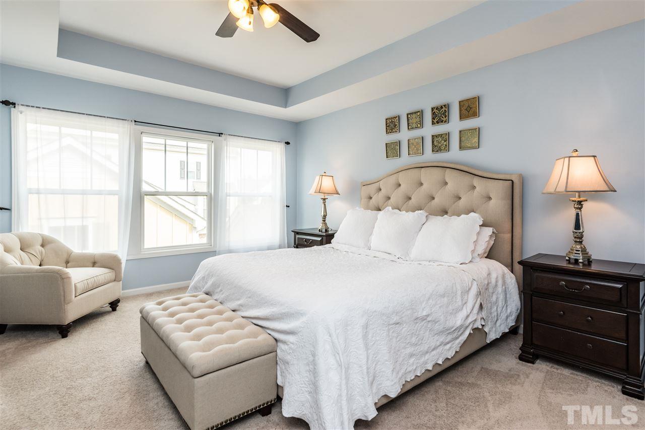 1413 Van Page Boulevard Raleigh, NC 27607 - Photo 13 of 25 a bedroom with bed and window
