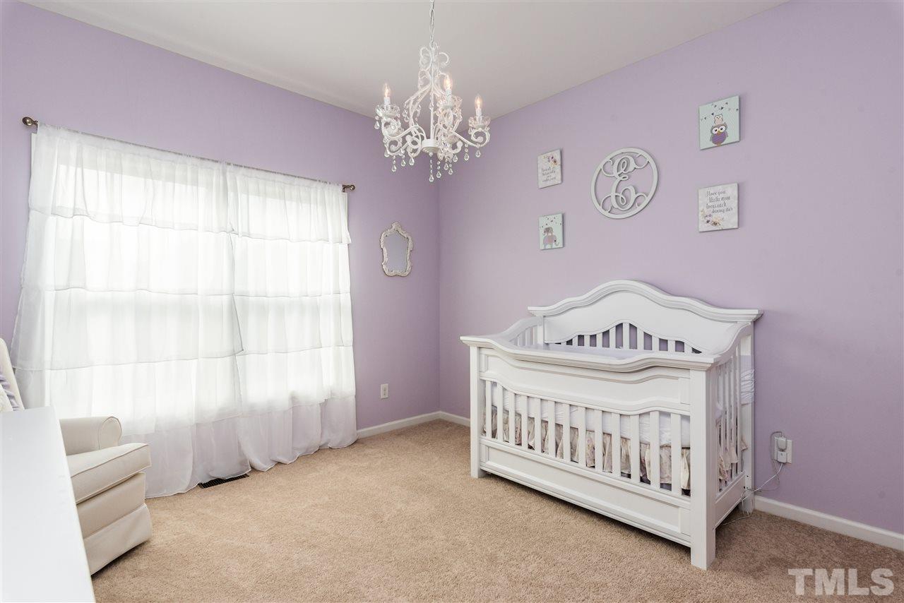 1413 Van Page Boulevard Raleigh, NC 27607 - Photo 18 of 25 a view of a room with window and ceiling fan