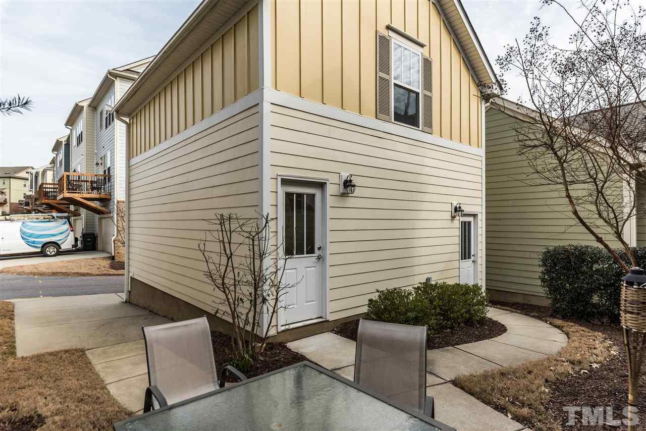 1413 Van Page Boulevard Raleigh, NC 27607 - Photo 21 of 25 a view of a house with backyard and sitting area