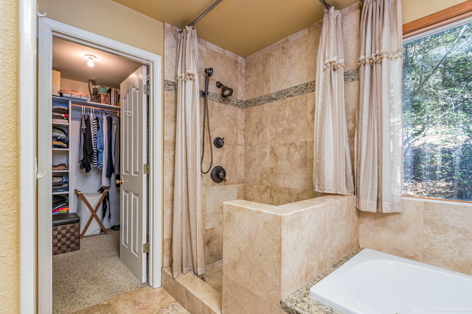 9290 Cramer Road Auburn, CA 95602 - Photo 28 of 67 a bathroom with a tub and shower