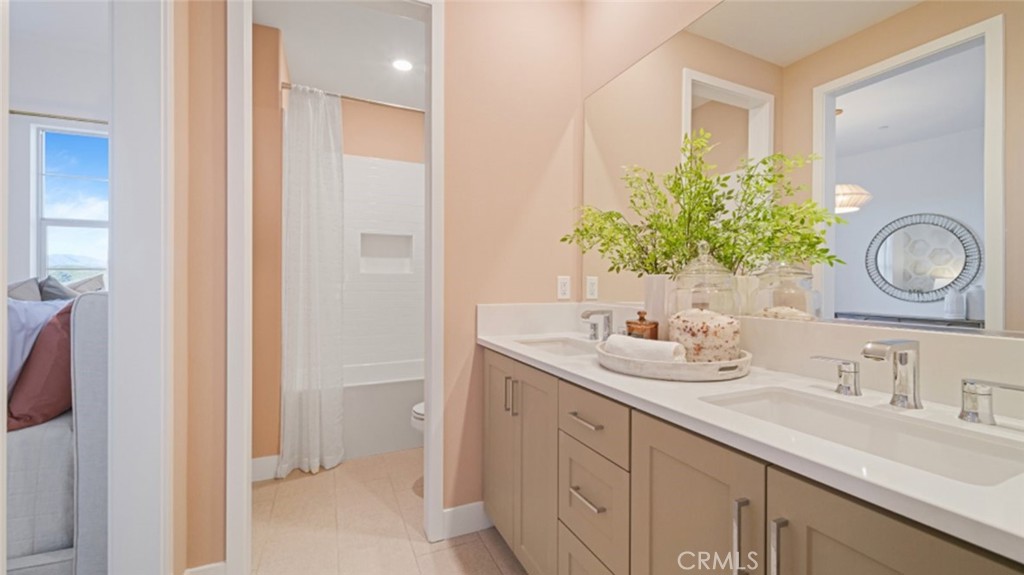 29809 Corte Trono Valencia, CA 91354 - Photo 20 of 36 a bathroom with a sink and a mirror