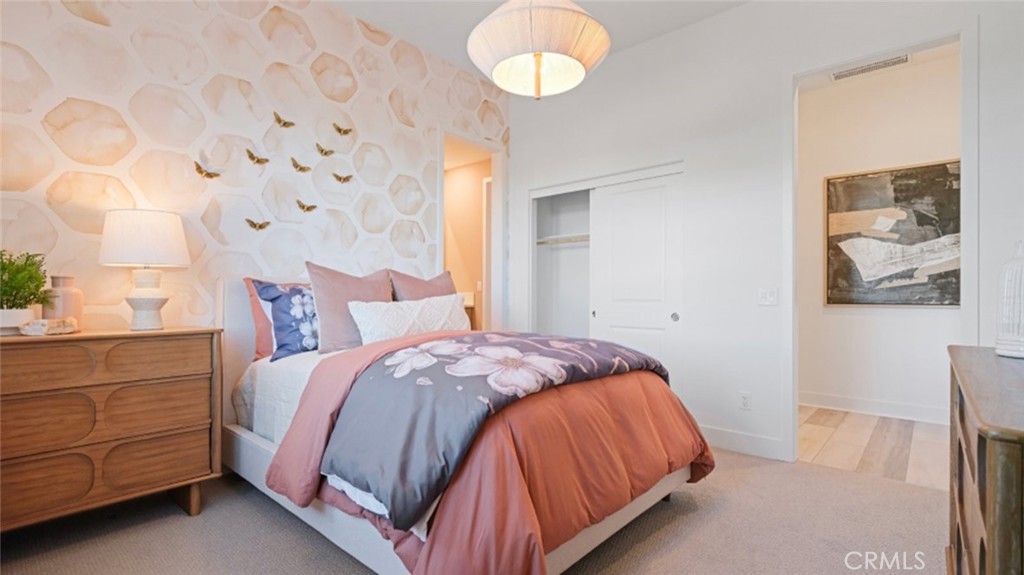 29809 Corte Trono Valencia, CA 91354 - Photo 22 of 36 a bedroom with a bed and a chandelier