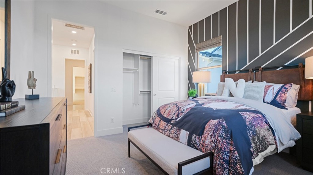 29809 Corte Trono Valencia, CA 91354 - Photo 24 of 36 a bedroom with a bed a mirror and a desk