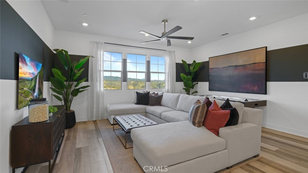 29809 Corte Trono Valencia, CA 91354 - Photo 29 of 36 a living room with furniture and a flat screen tv