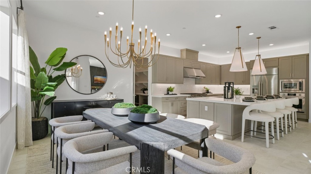 29809 Corte Trono Valencia, CA 91354 - Photo 6 of 36 a dining room filled chandelier and kitchen view