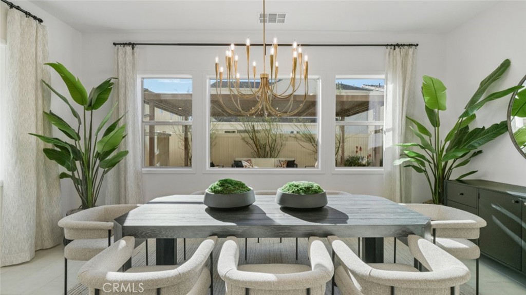 29809 Corte Trono Valencia, CA 91354 - Photo 7 of 36 a view of a dining room with furniture and window