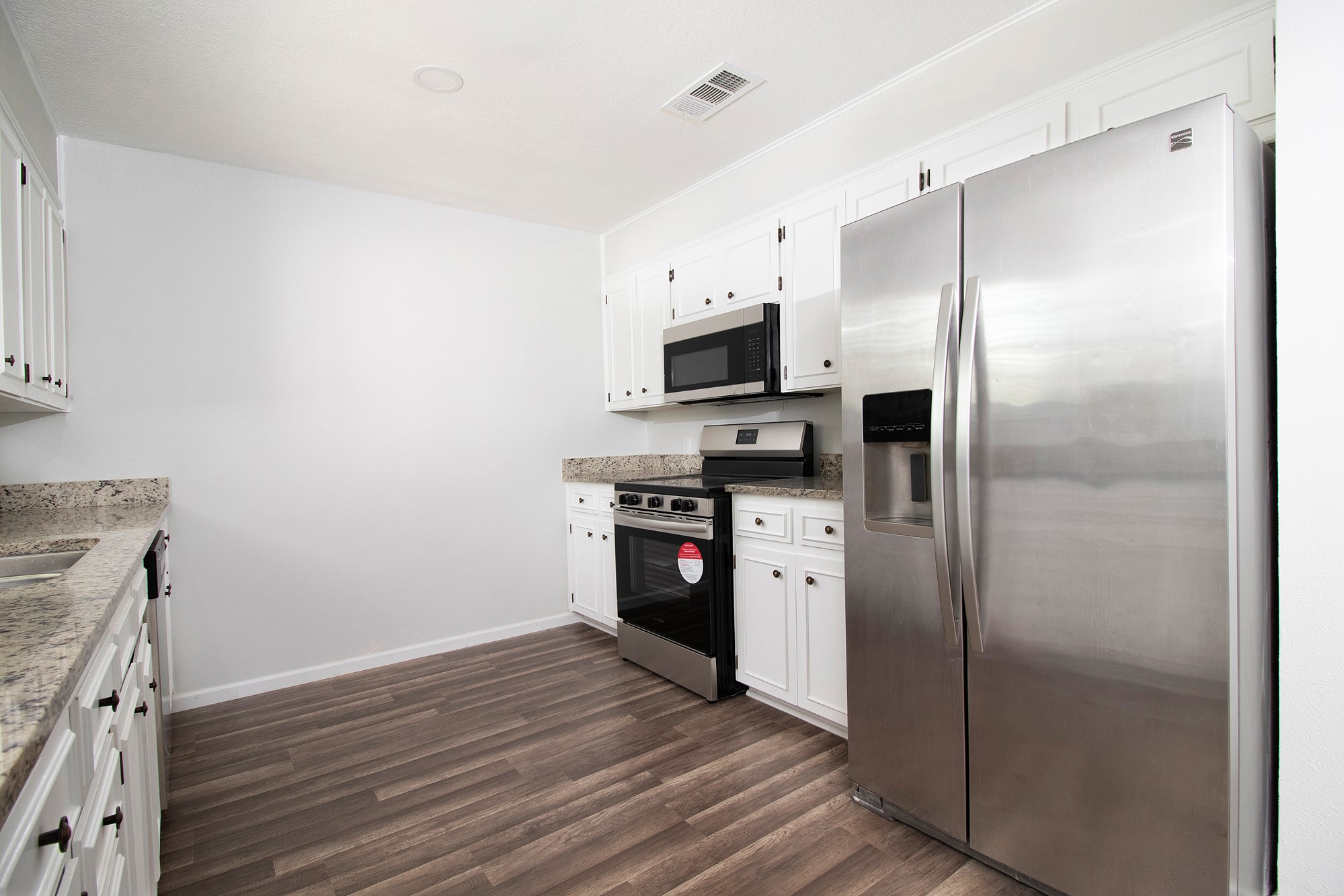 2510 Bunker Hill Drive Temple, TX 76504 - Photo 12 of 30 a kitchen with stainless steel appliances a refrigerator and a stove