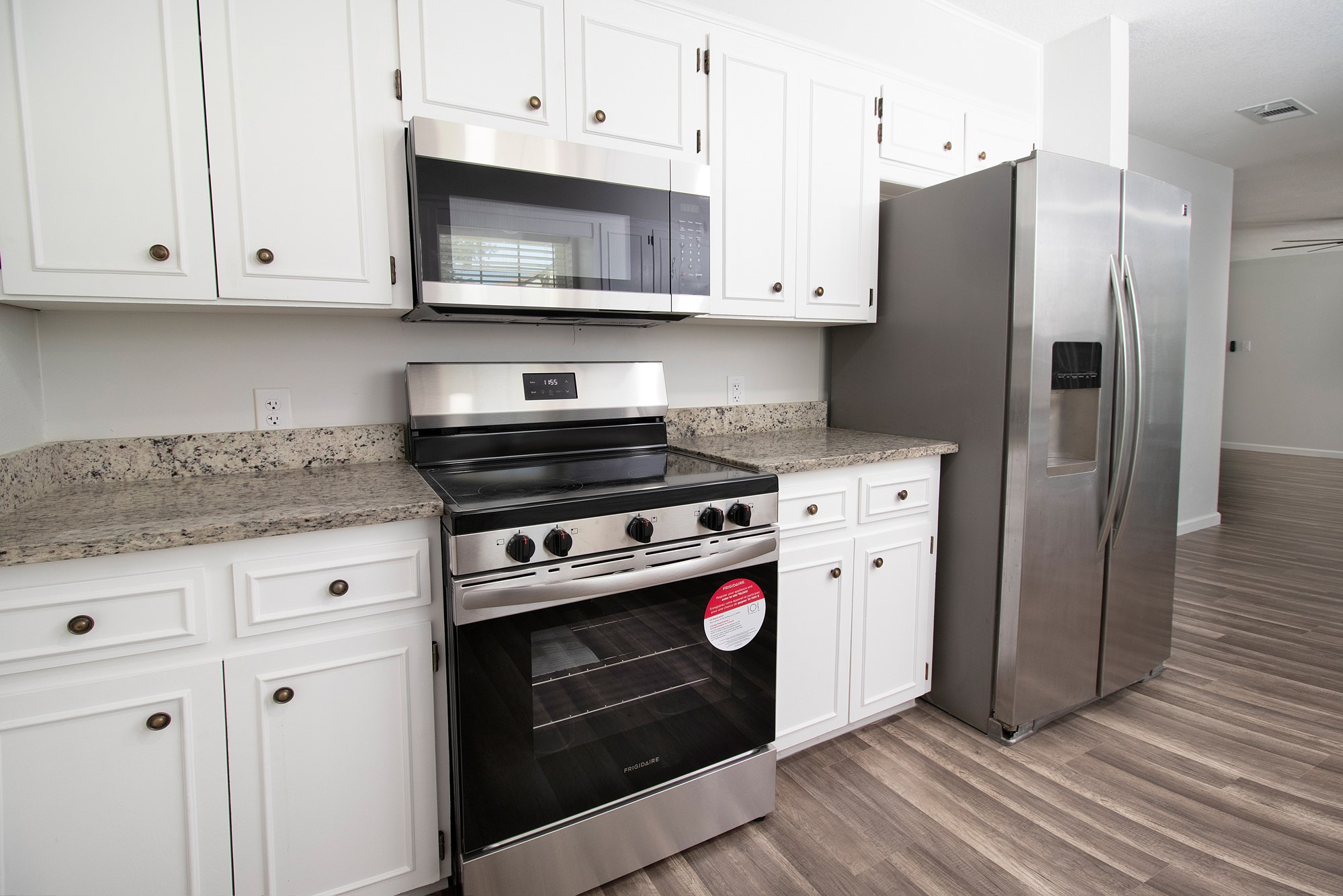 2510 Bunker Hill Drive Temple, TX 76504 - Photo 13 of 30 a kitchen with stainless steel appliances granite countertop a stove a refrigerator and a cabinets