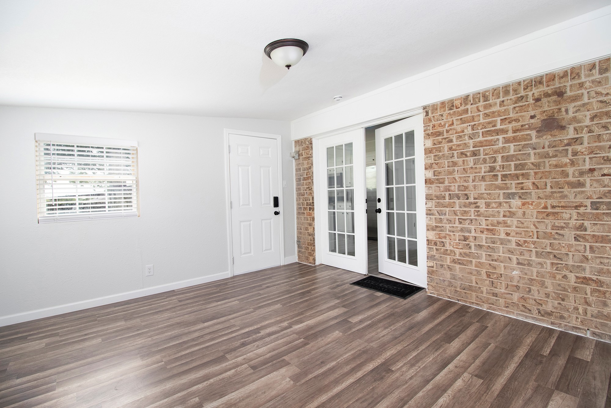 2510 Bunker Hill Drive Temple, TX 76504 - Photo 14 of 30 a view of an empty room with wooden floor and a window