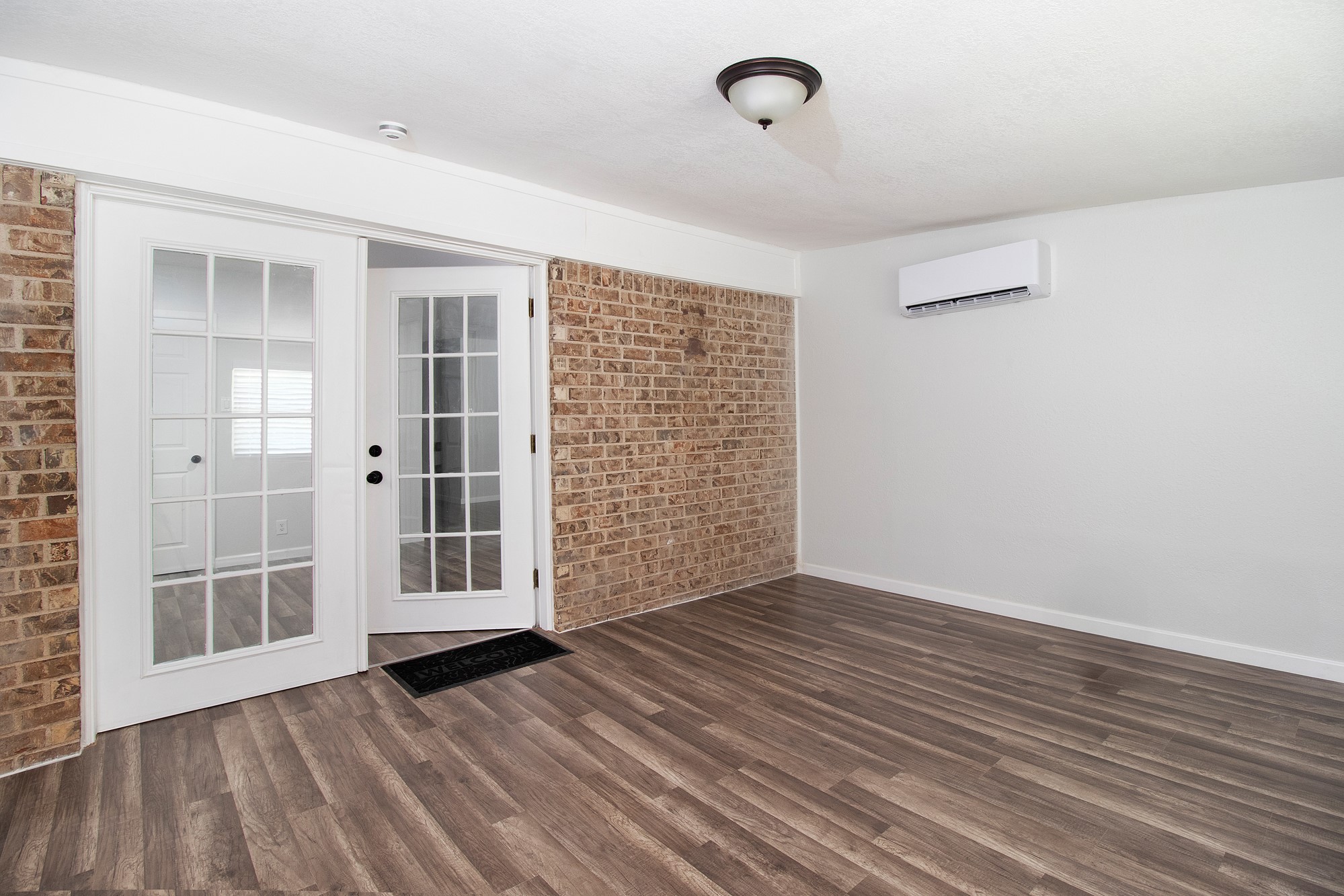 2510 Bunker Hill Drive Temple, TX 76504 - Photo 15 of 30 an empty room with wooden floor and windows