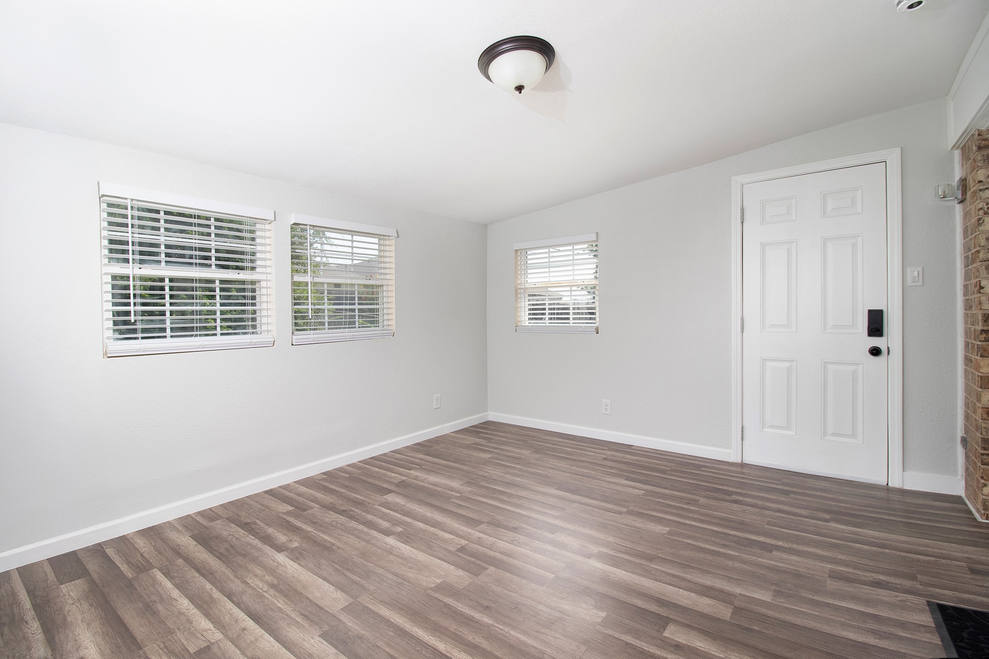 2510 Bunker Hill Drive Temple, TX 76504 - Photo 16 of 30 a view of empty room with wooden floor and windows