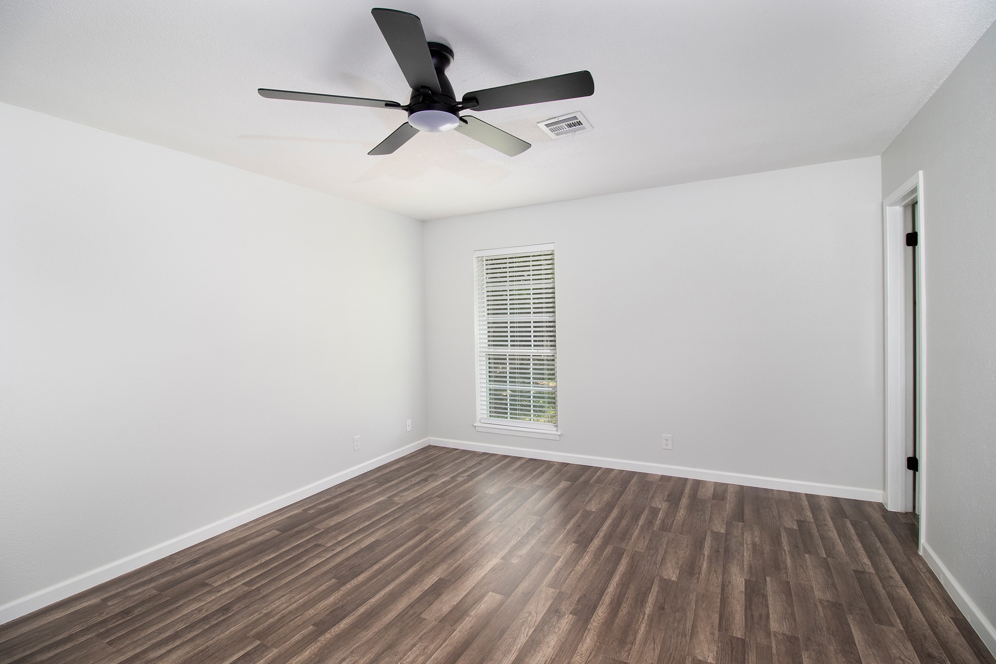 2510 Bunker Hill Drive Temple, TX 76504 - Photo 17 of 30 a view of a room with wooden floor and a ceiling fan