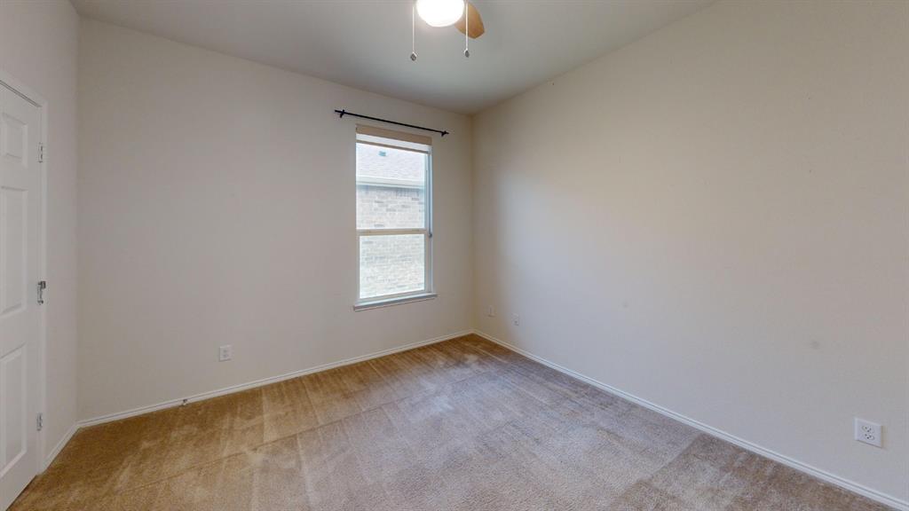 2213 Heaton Street Forney, TX 75126 - Photo 9 of 14 Carpeted room with a ceiling fan light fixture