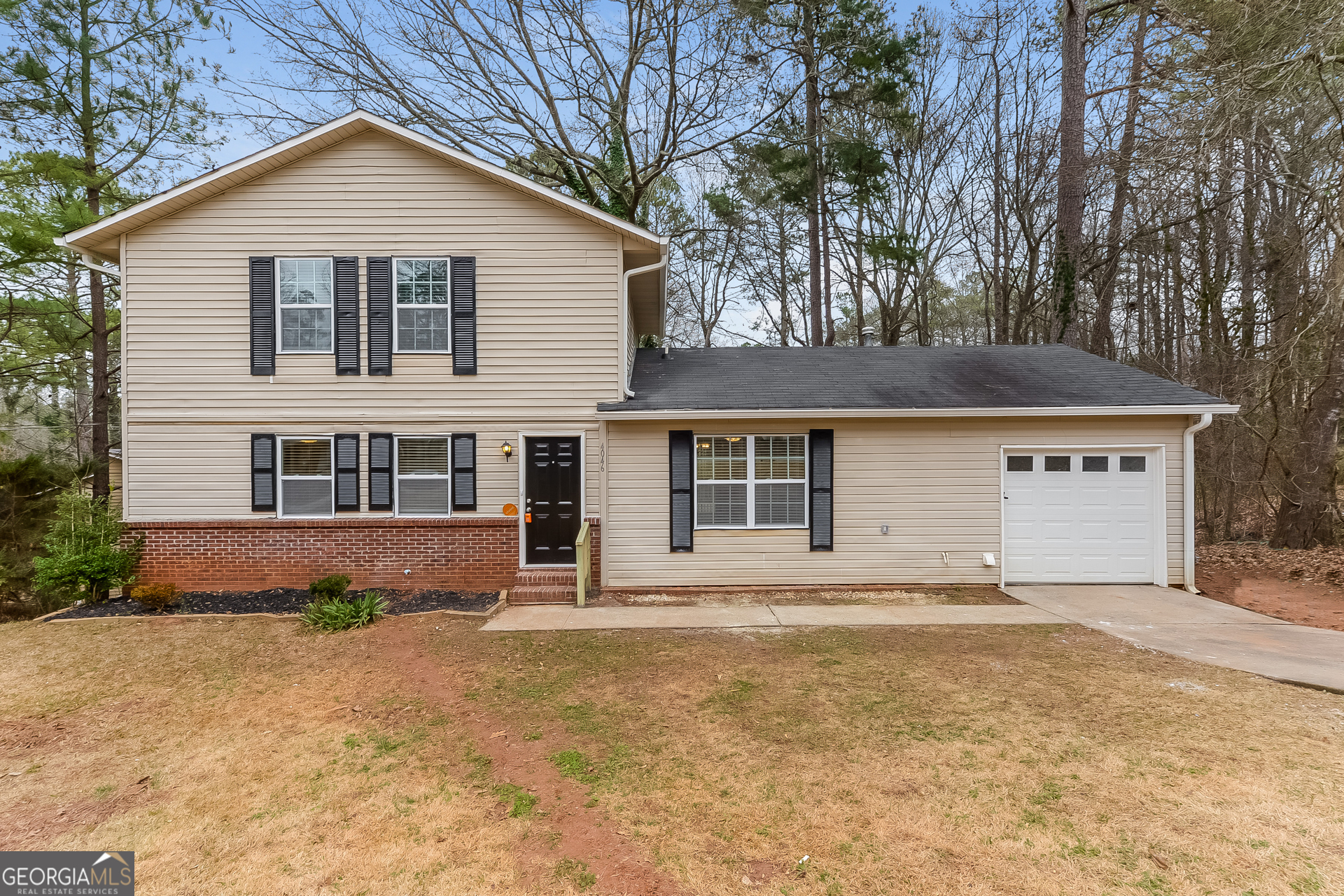 4046 Shane Trail Ellenwood, GA 30294 - Photo 1 of 1 a front view of a house with a yard