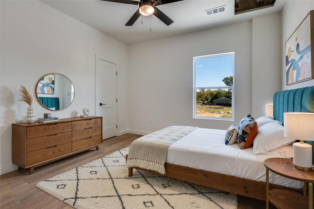 516 South O Connor Road Irving, TX 75060 - Photo 11 of 40 a bedroom with a bed and a dresser