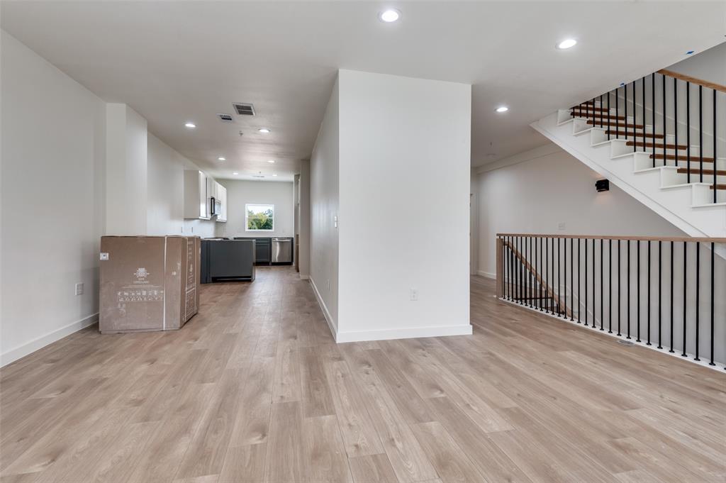 516 South O Connor Road Irving, TX 75060 - Photo 21 of 40 a view of kitchen with furniture and wooden floor
