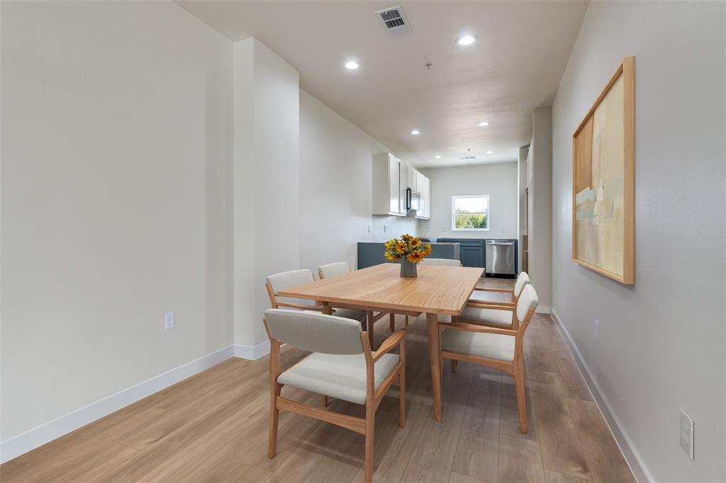 516 South O Connor Road Irving, TX 75060 - Photo 24 of 40 a view of a dining room with furniture and wooden floor