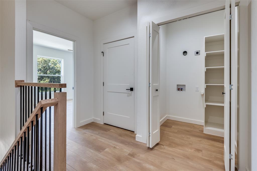 516 South O Connor Road Irving, TX 75060 - Photo 32 of 40 a view of a hallway with wooden floor and entryway