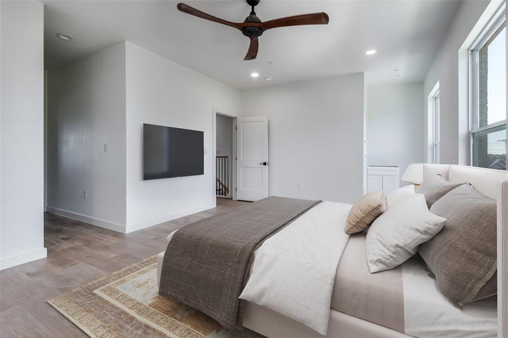 516 South O Connor Road Irving, TX 75060 - Photo 36 of 40 a bedroom with a bed and a flat screen tv