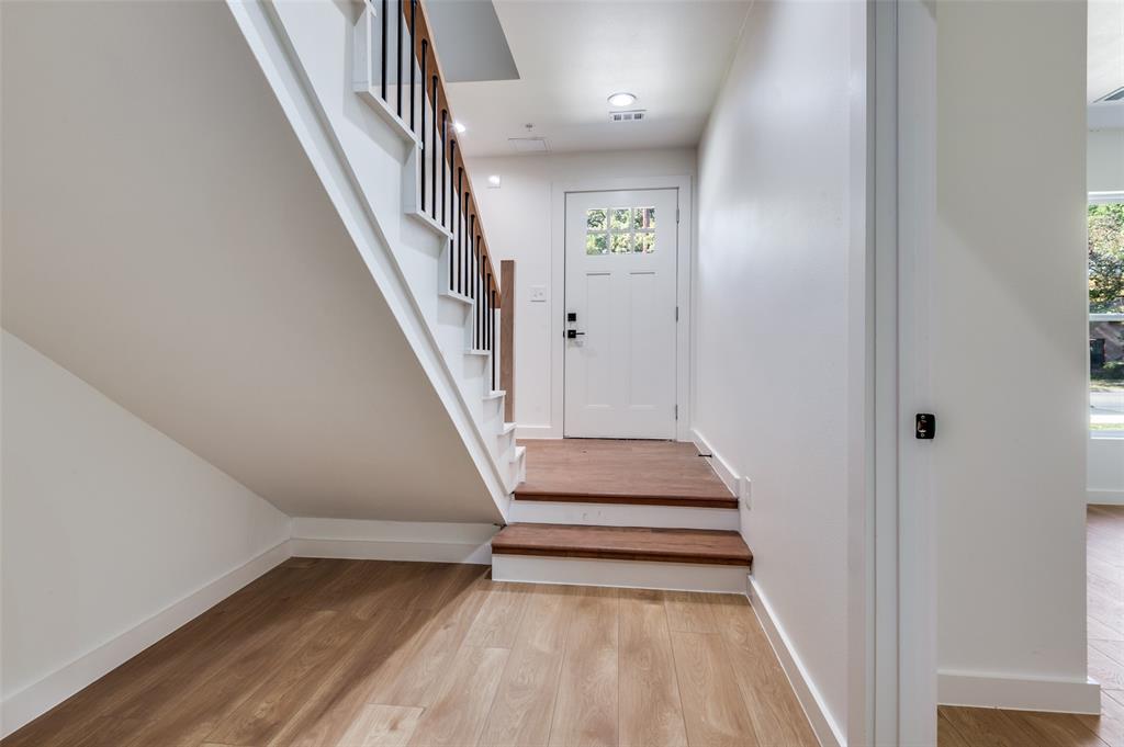 516 South O Connor Road Irving, TX 75060 - Photo 8 of 40 a view of entryway and hall with wooden floor