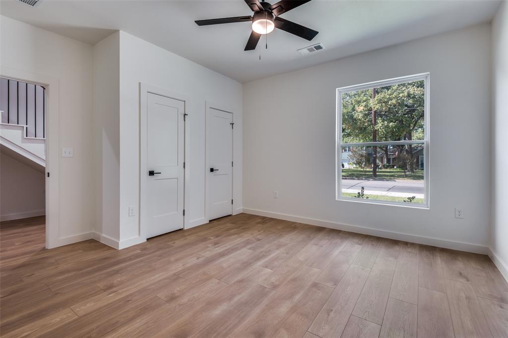 516 South O Connor Road Irving, TX 75060 - Photo 9 of 40 a view of an empty room with wooden floor and a window
