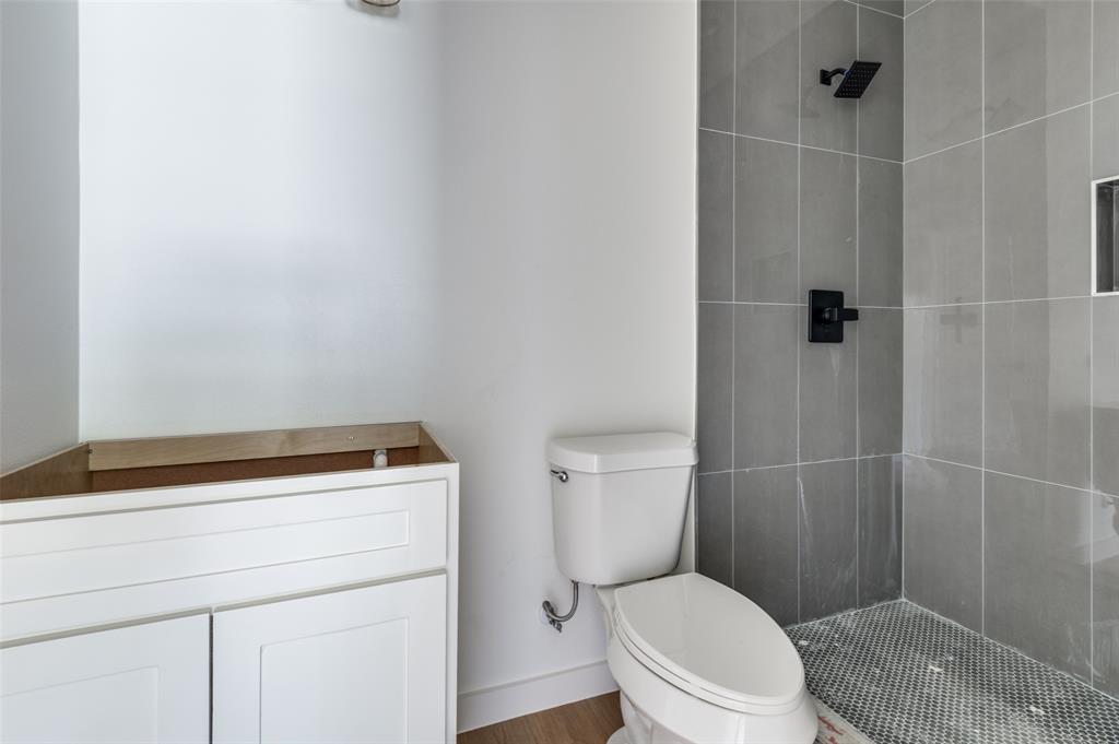 516 South O Connor Road Irving, TX 75060 - Photo 10 of 40 a bathroom with a toilet and a shower