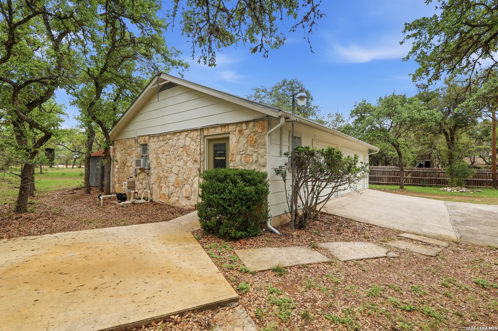 261 Fawn Lane Spring Branch, TX 78070 - Photo 30 of 44 a view of a house with backyard and trees