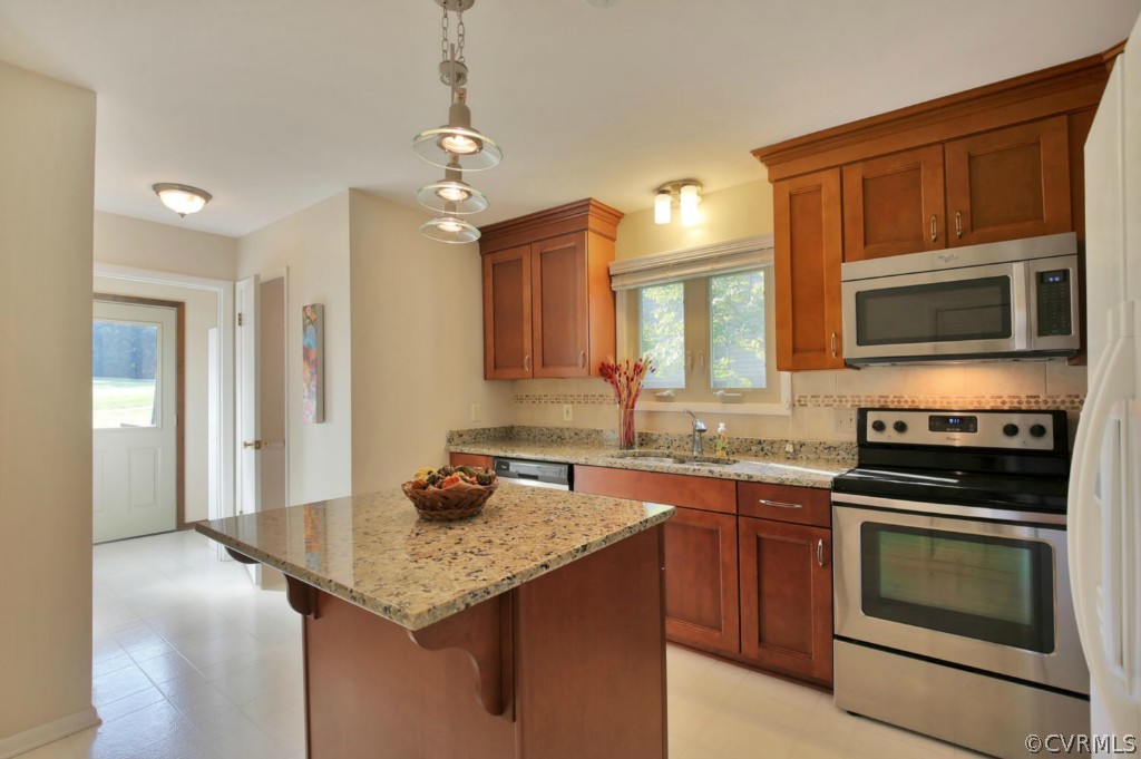 3509 Stoney Ridge Road Midlothian, VA 23112 - Photo 12 of 24 a kitchen with a sink stove and microwave