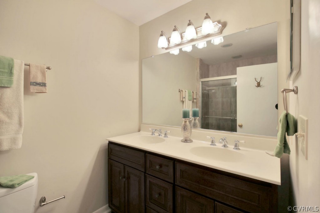 3509 Stoney Ridge Road Midlothian, VA 23112 - Photo 17 of 24 a bathroom with a sink double vanity and a mirror