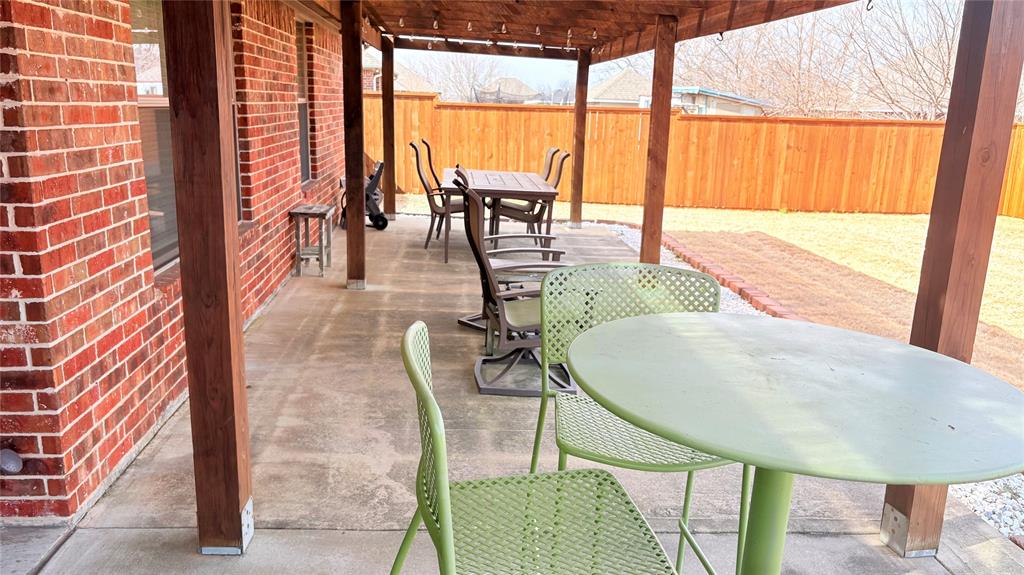 312 McAfee Street Mabank, TX 75147 - Photo 4 of 40 a view of an outdoor dining space with furniture