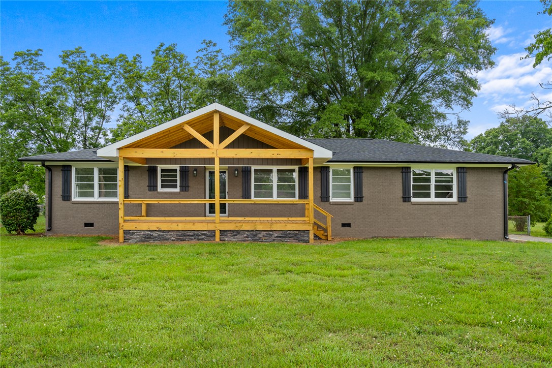 300 Vandiver Road Anderson, SC 29621 - Photo 1 of 30 A welcoming front porch with exposed timber framing provides an inviting entry to this residence.