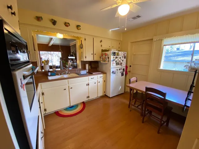 a large kitchen with cabinets