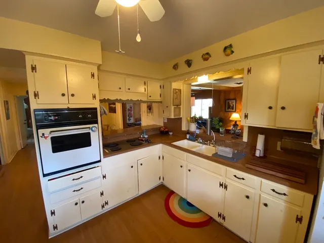 a view of a kitchen with appliances and cabinets