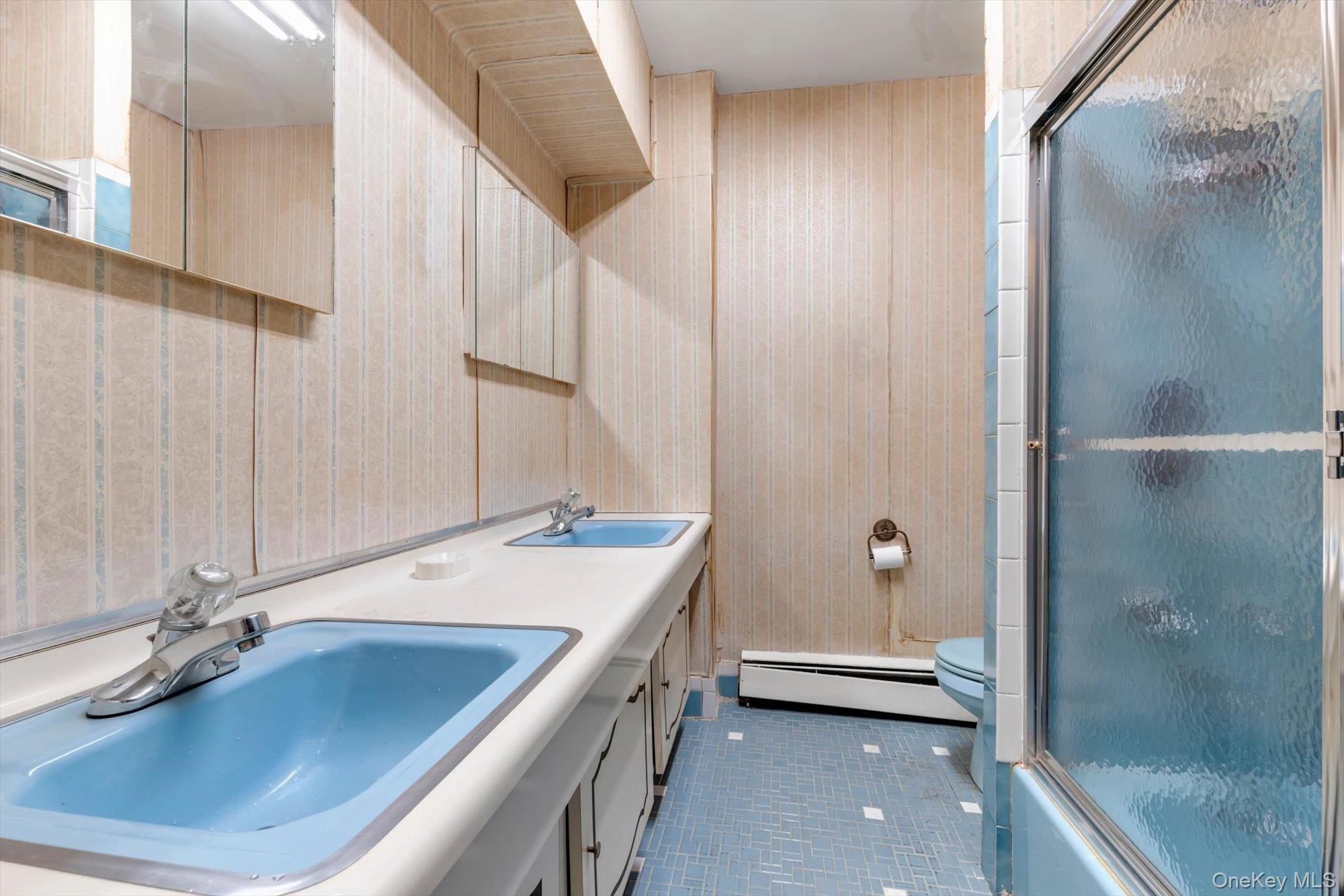 144-64 25th Road Queens, NY 11354 - Photo 16 of 21 a bathroom with a tub a sink and mirror