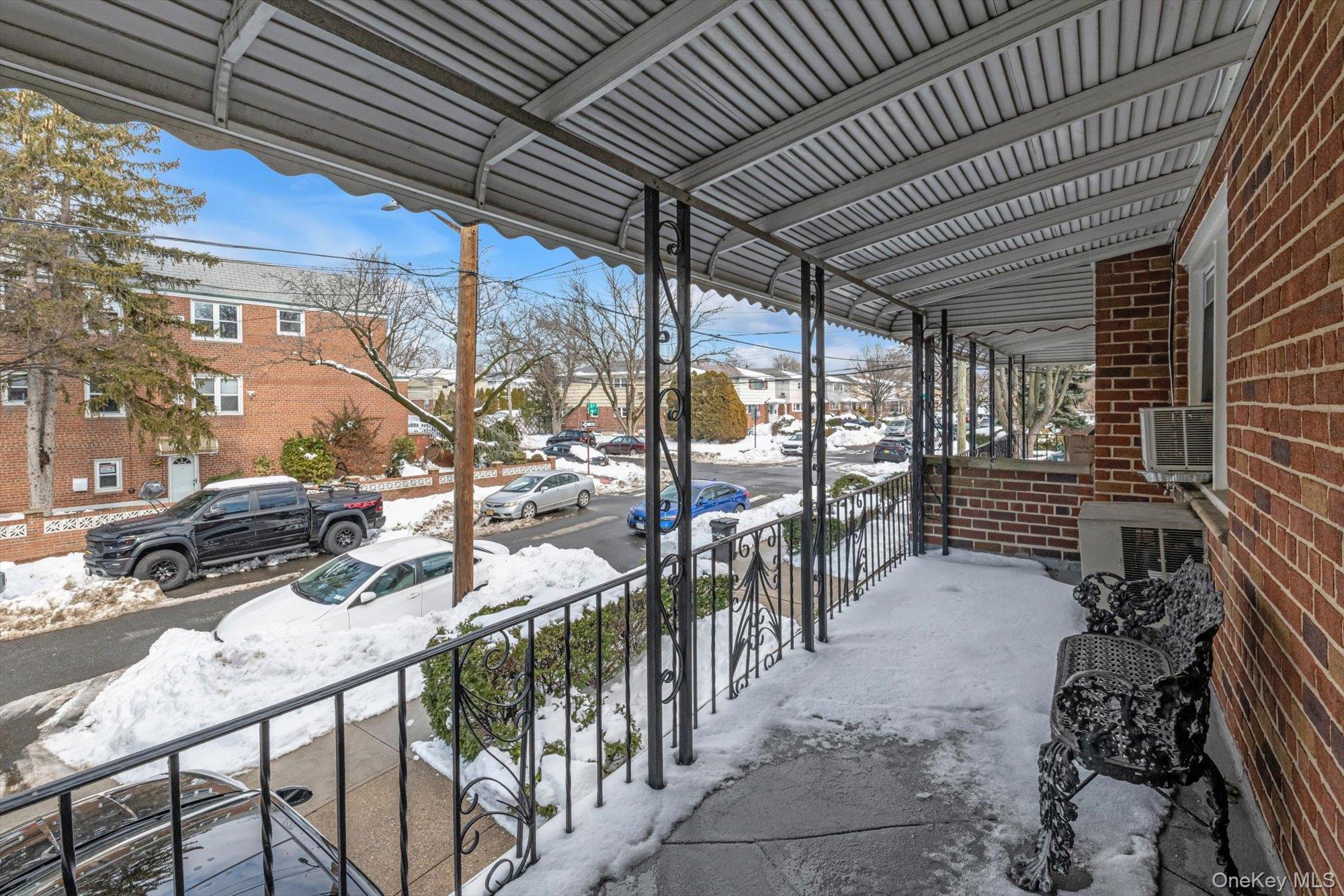 144-64 25th Road Queens, NY 11354 - Photo 17 of 21 a view of a patio with table and chairs with wooden floor and fence