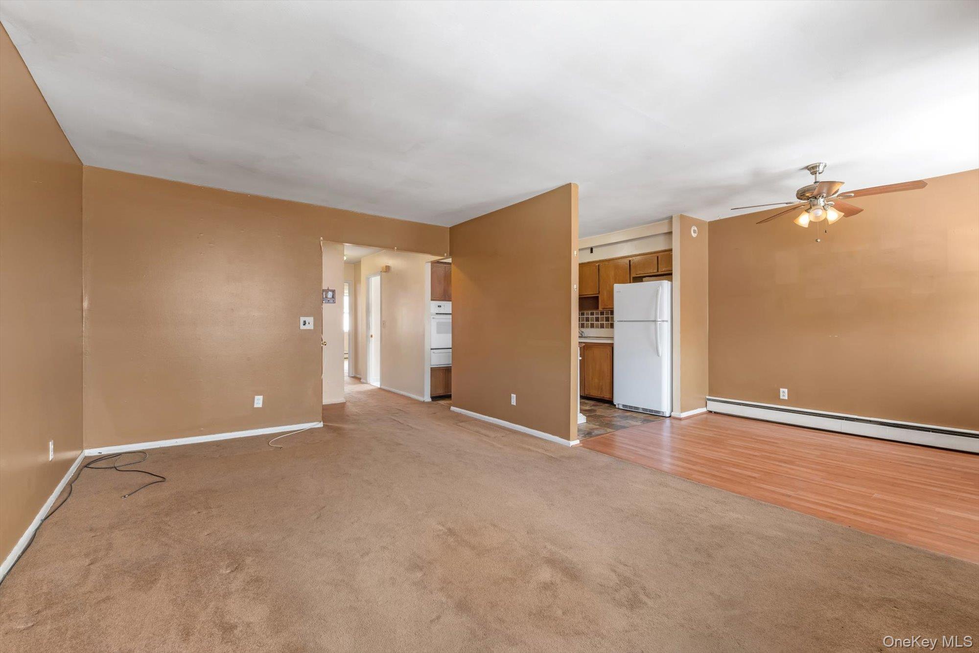 144-64 25th Road Queens, NY 11354 - Photo 3 of 21 an empty room with closet and windows