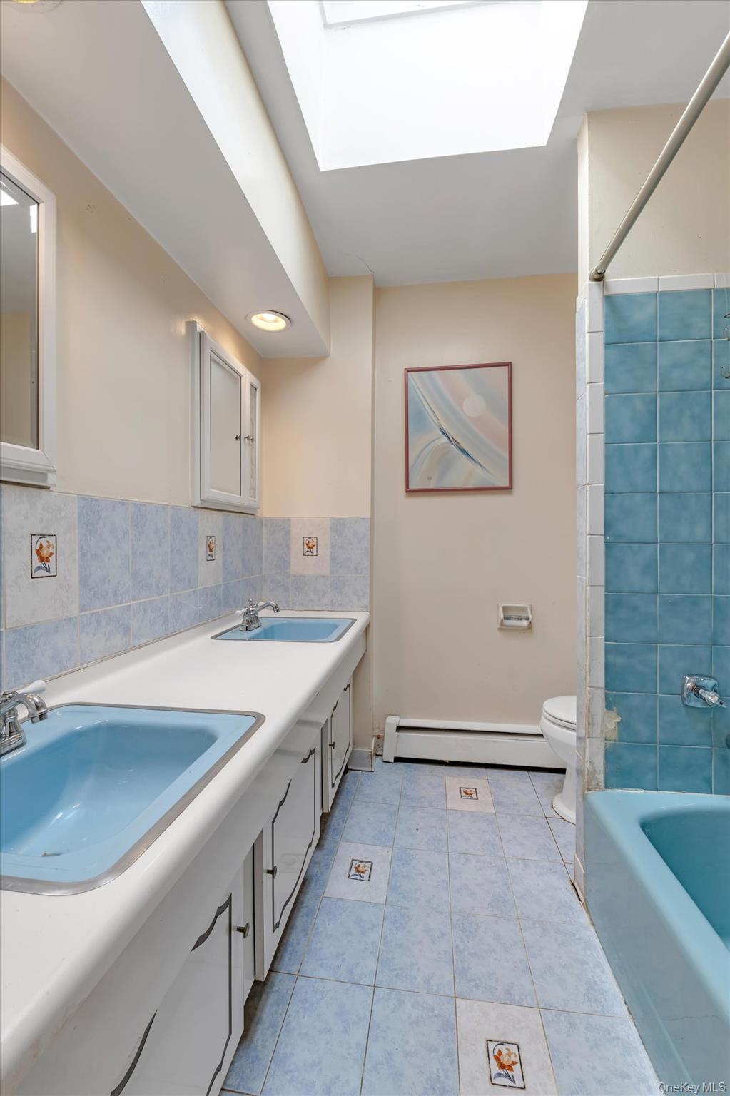 144-64 25th Road Queens, NY 11354 - Photo 8 of 21 a bathroom with a tub a sink and mirror