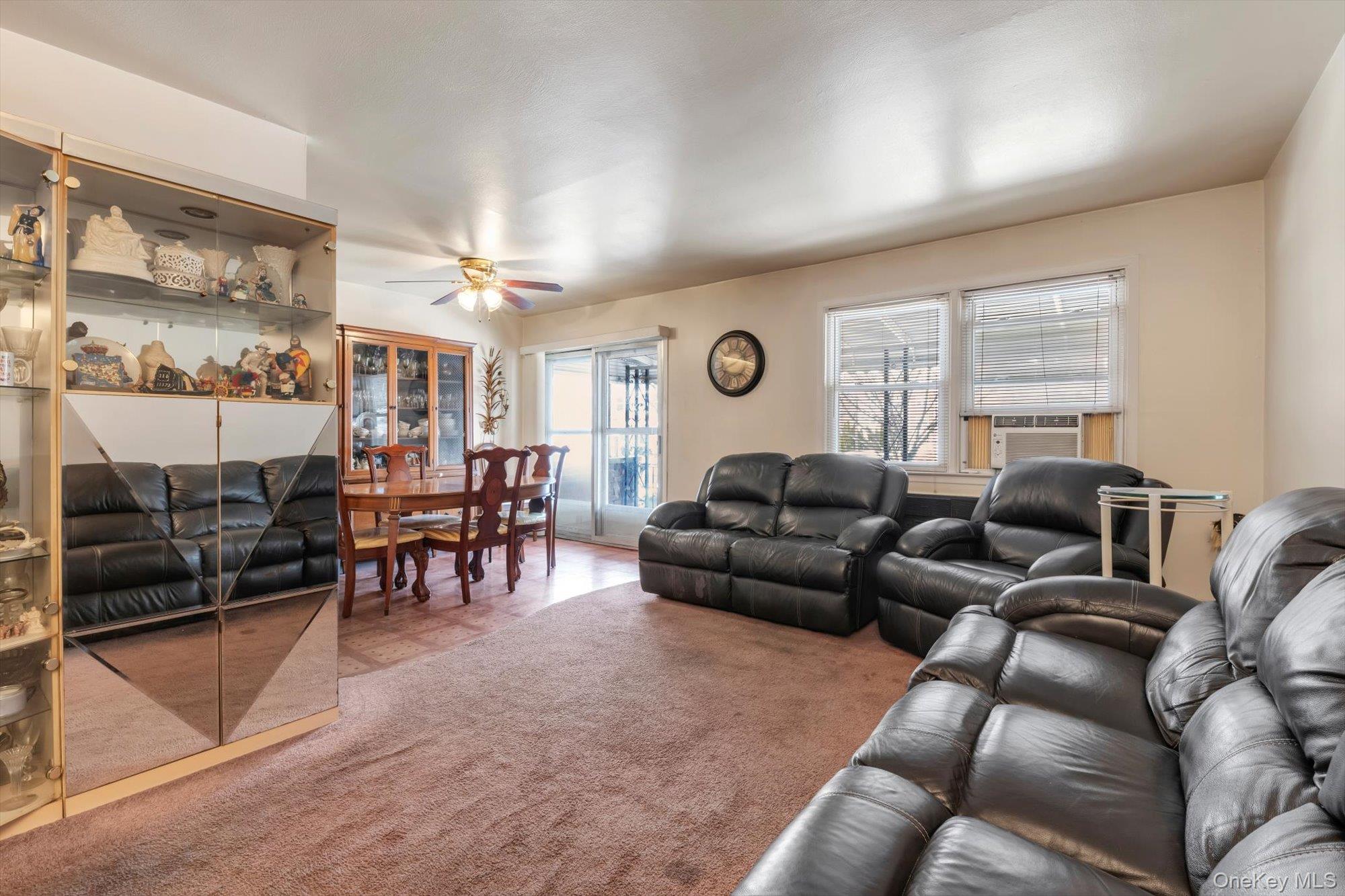 144-64 25th Road Queens, NY 11354 - Photo 9 of 21 a living room with furniture and a large window
