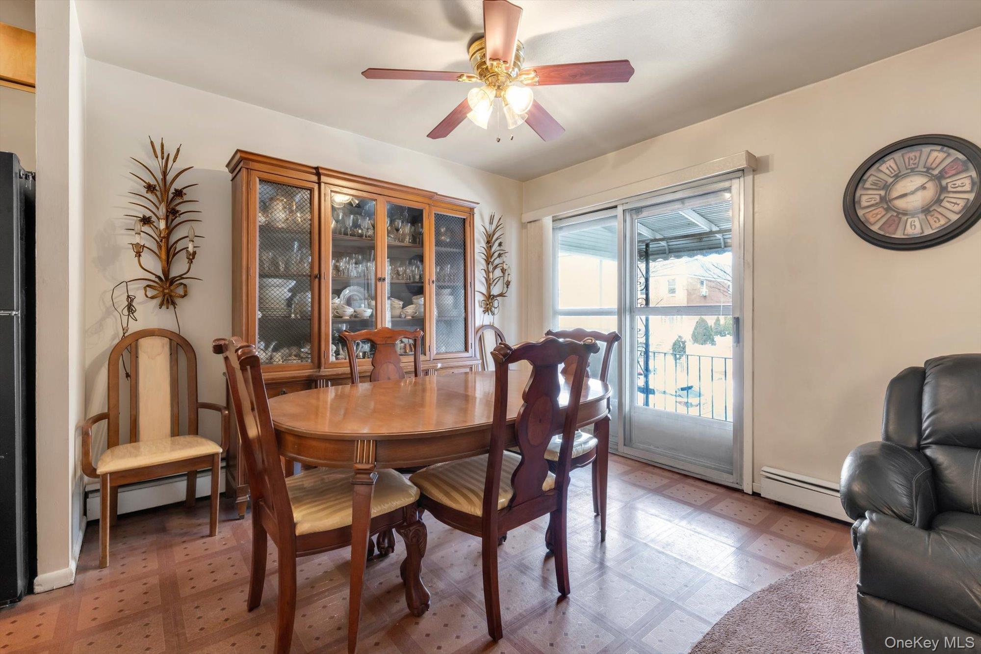 144-64 25th Road Queens, NY 11354 - Photo 10 of 21 a dining room with furniture a chandelier and a rug