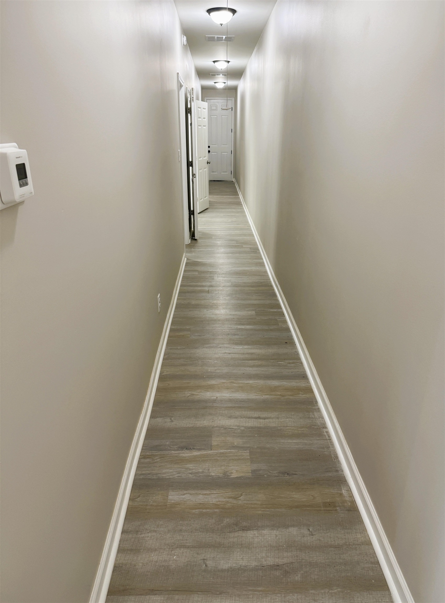 547 Berclair Road, Unit 101 Memphis, TN 38122 - Photo 8 of 19 Hall with baseboards and light wood-type flooring