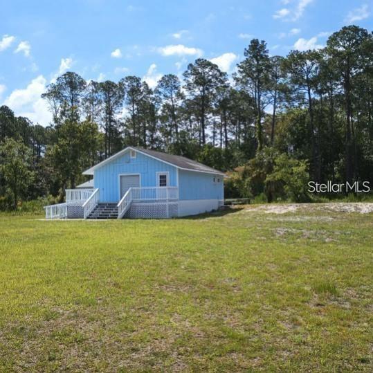 7230 Southwest 111th Terrace Cedar Key, FL 32625 - Photo 3 of 7 a house view with a outdoor space