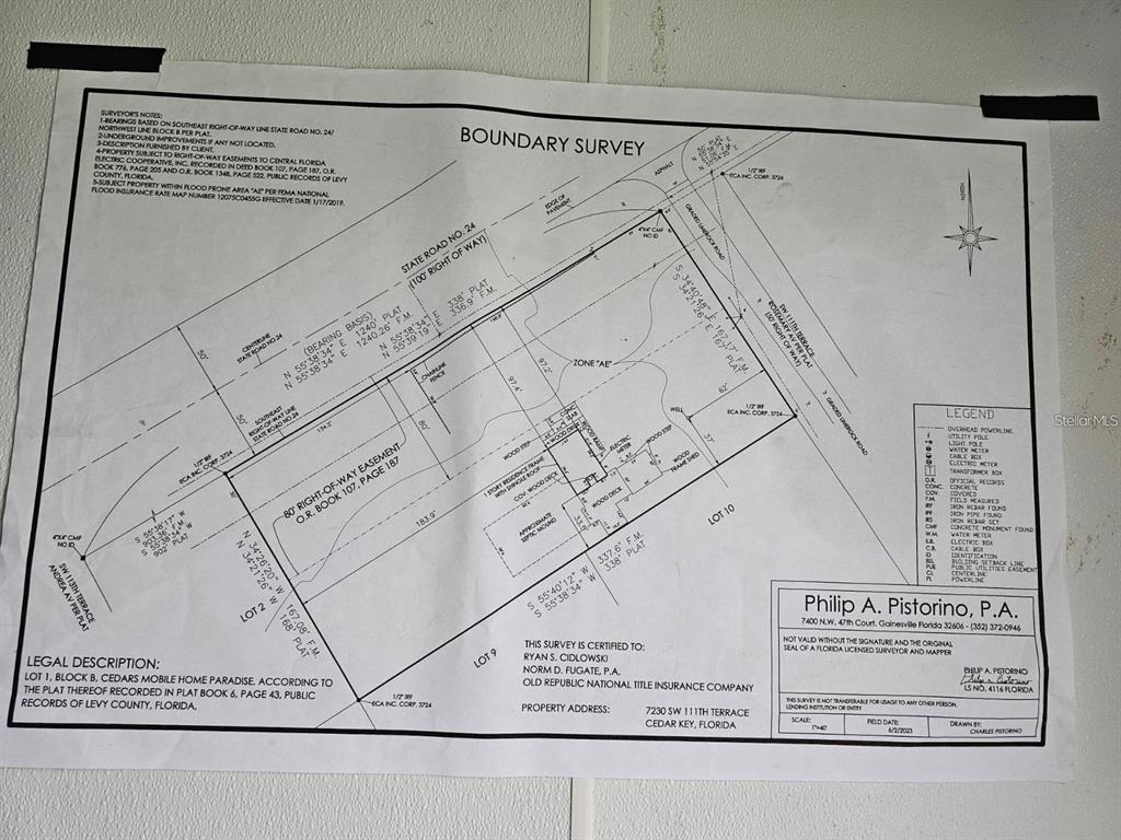 7230 Southwest 111th Terrace Cedar Key, FL 32625 - Photo 7 of 7 a black and white photo of a book